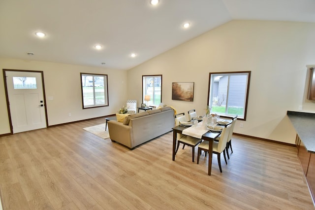 living area with lofted ceiling, light wood-style flooring, baseboards, and recessed lighting