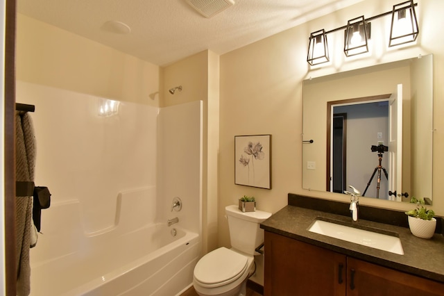 full bath featuring washtub / shower combination, visible vents, vanity, and toilet