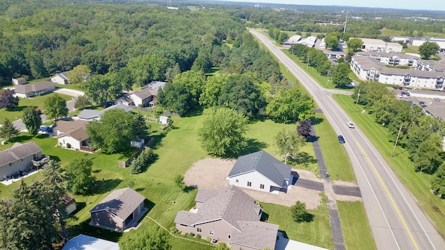 bird's eye view featuring a residential view and a forest view