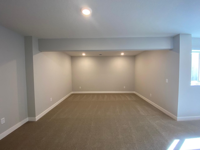 basement featuring baseboards, carpet flooring, and recessed lighting