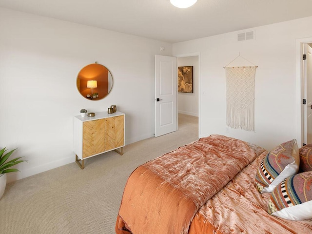 carpeted bedroom with visible vents