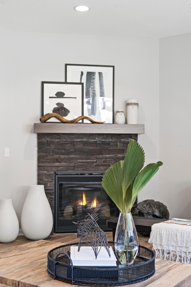 interior details featuring a glass covered fireplace