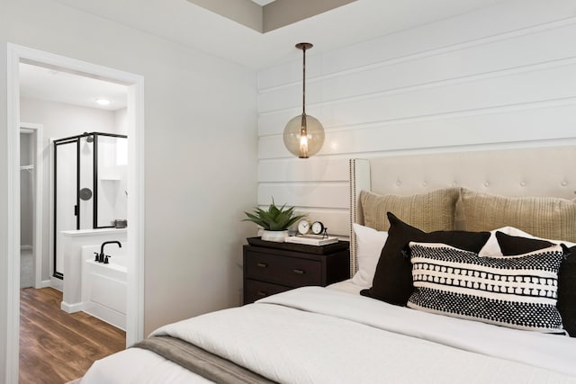 bedroom featuring wood finished floors