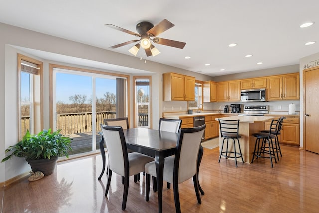 dining room featuring recessed lighting, plenty of natural light, and light wood-style flooring