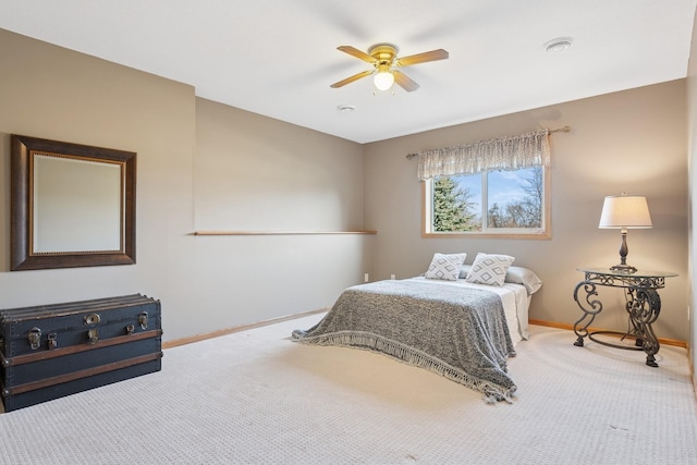 bedroom featuring a ceiling fan, baseboards, and carpet floors