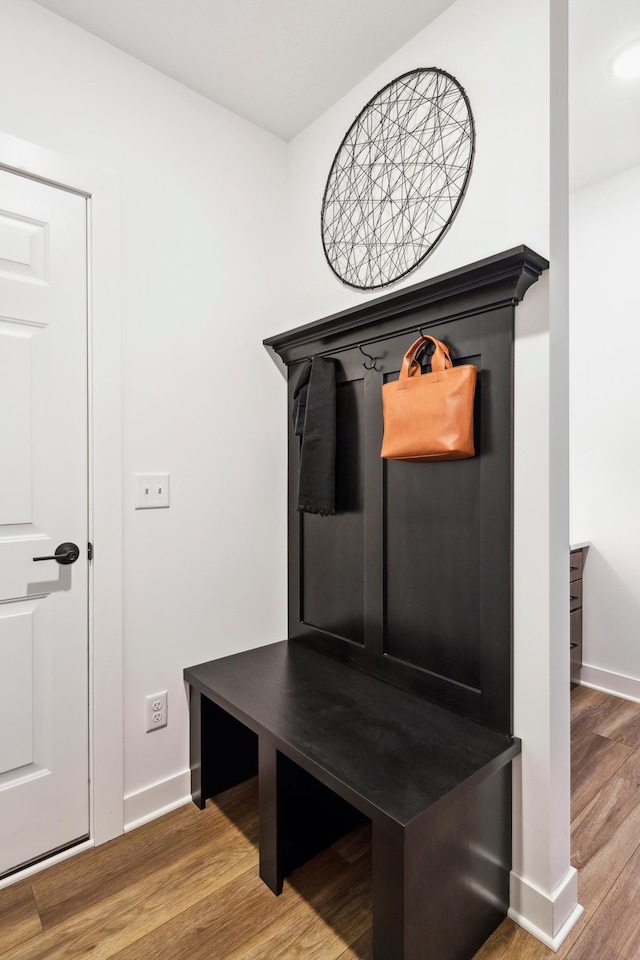 mudroom with baseboards and wood finished floors