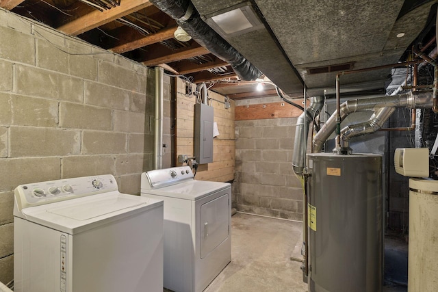 laundry area featuring laundry area, electric panel, washer and clothes dryer, and gas water heater