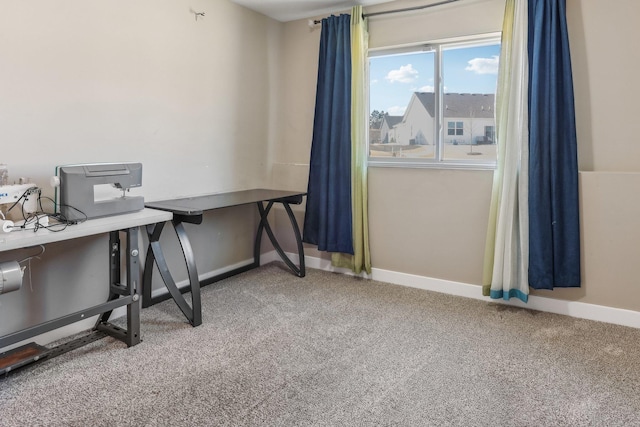 carpeted home office with baseboards