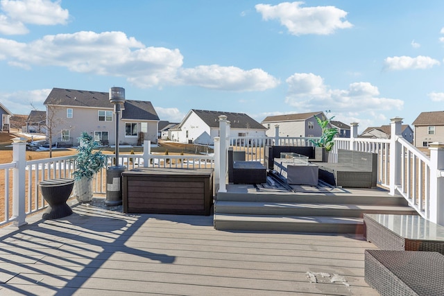 wooden deck featuring a residential view and an outdoor hangout area