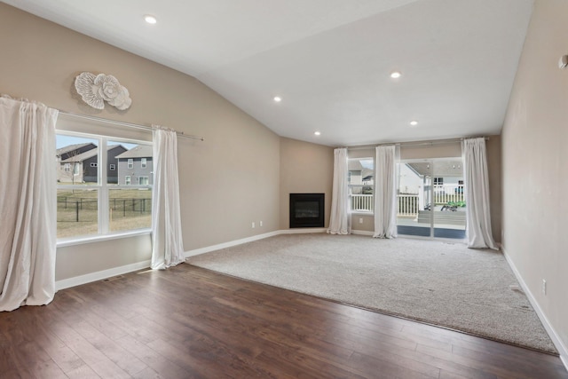 7295 Parson Ct NE, Otsego, MN 55330 - unfurnished living room with a wealth of natural light, wood finished floors, and baseboards