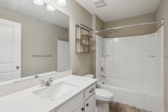 7295 Parson Ct NE, Otsego, MN 55330 - full bathroom featuring washtub / shower combination, vanity, toilet, visible vents, and wood finished floors