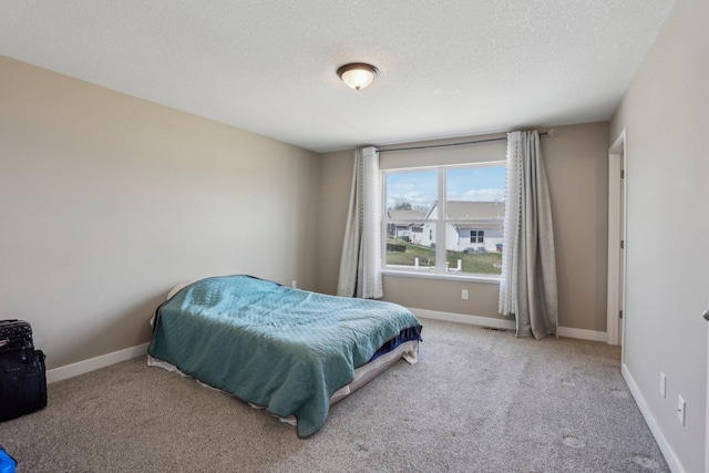 7295 Parson Ct NE, Otsego, MN 55330 - bedroom with a textured ceiling, carpet flooring, visible vents, and baseboards