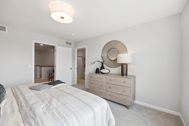 bedroom featuring light colored carpet, visible vents, and baseboards