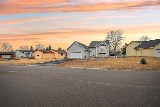 single story home featuring driveway and a residential view