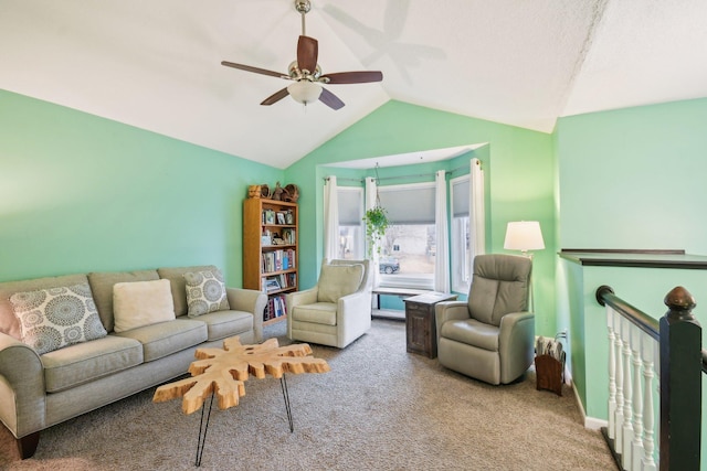 living room featuring carpet flooring, vaulted ceiling, and ceiling fan