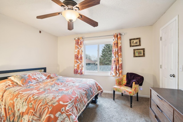 carpeted bedroom with ceiling fan, a textured ceiling, and baseboards