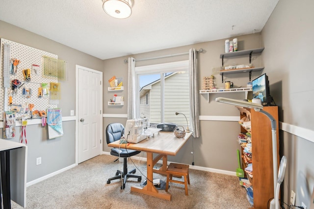 office space with a textured ceiling, carpet flooring, and baseboards