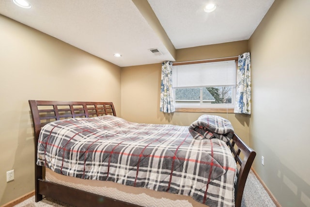 bedroom featuring carpet, visible vents, baseboards, and recessed lighting