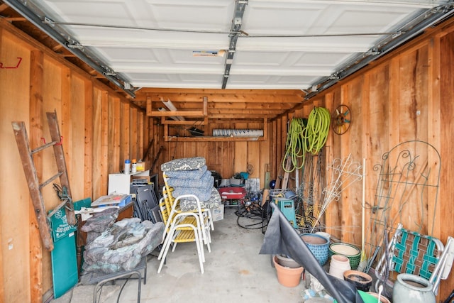 garage featuring wooden walls