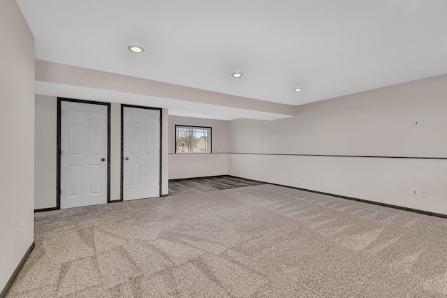 unfurnished bedroom with carpet, baseboards, and recessed lighting