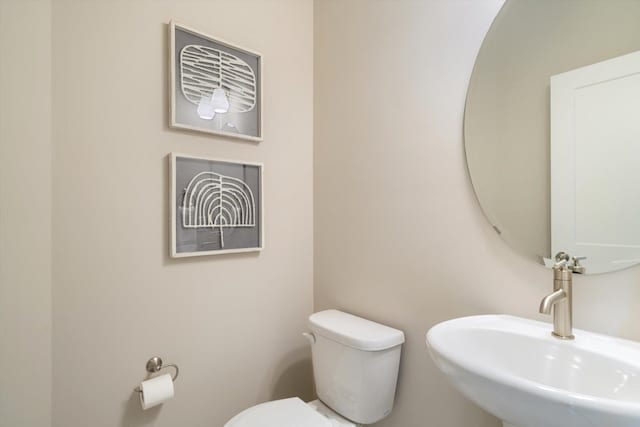 bathroom with a sink and toilet