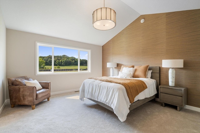 bedroom featuring high vaulted ceiling, baseboards, and light colored carpet