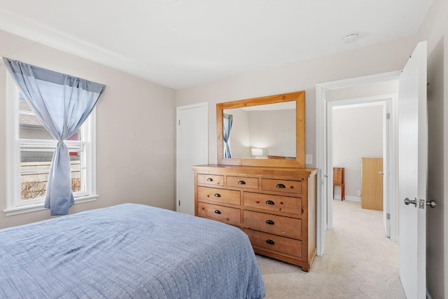bedroom featuring light colored carpet