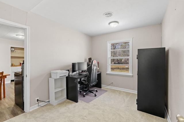 home office with baseboards, carpet, and visible vents