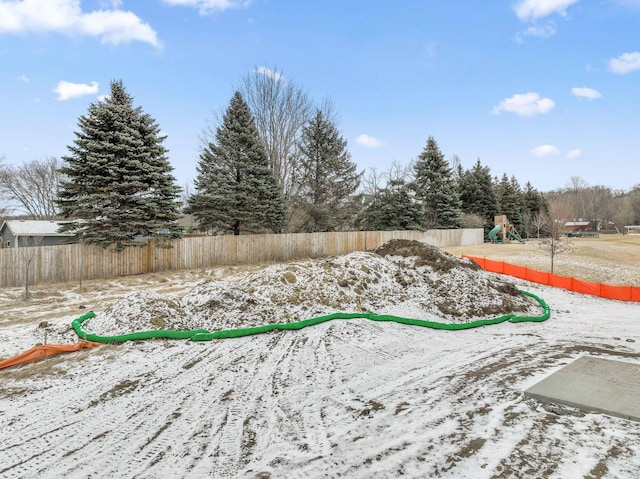 view of yard with fence and playground community