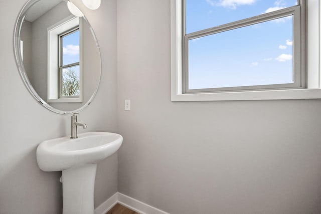 bathroom featuring baseboards and wood finished floors