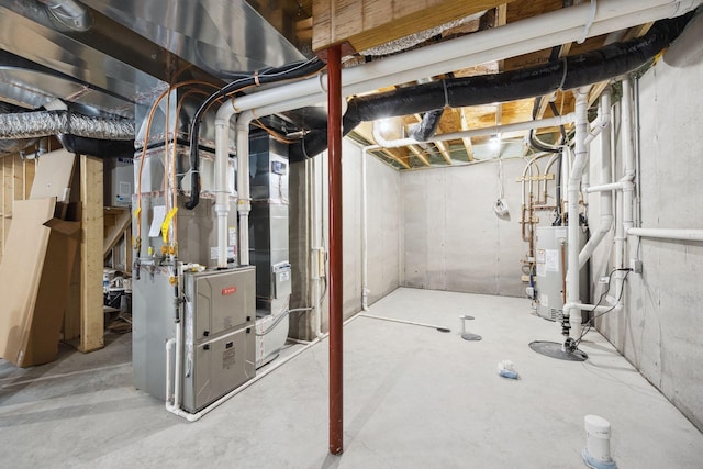 unfinished basement featuring gas water heater and heating unit