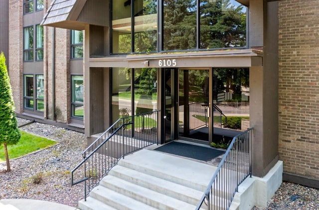 entrance to property with brick siding