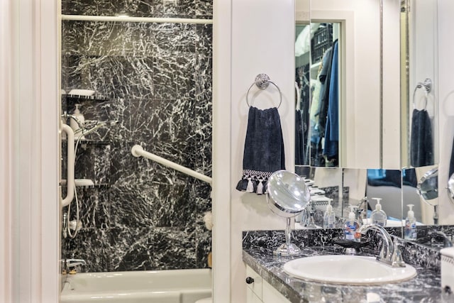 bathroom featuring vanity and bathing tub / shower combination