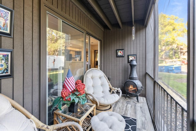 sunroom featuring beamed ceiling