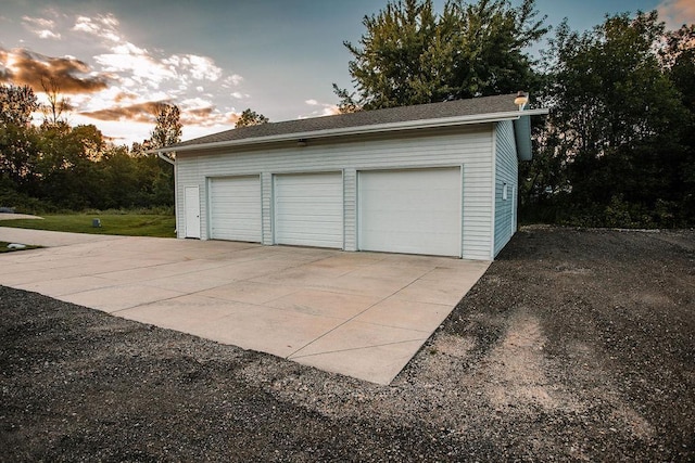 garage at dusk with a garage