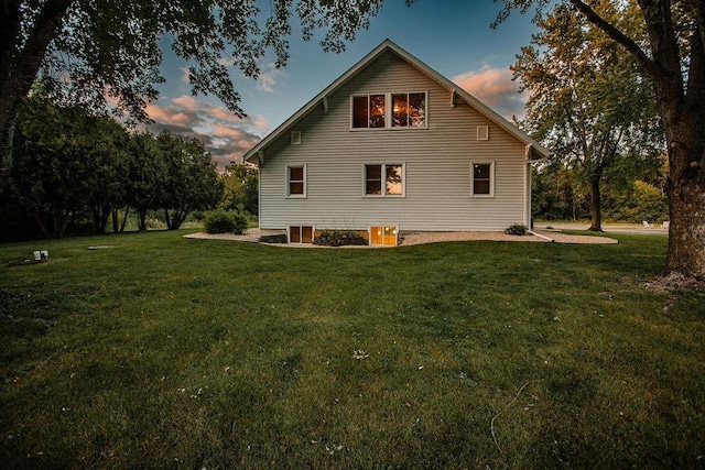 rear view of house with a lawn