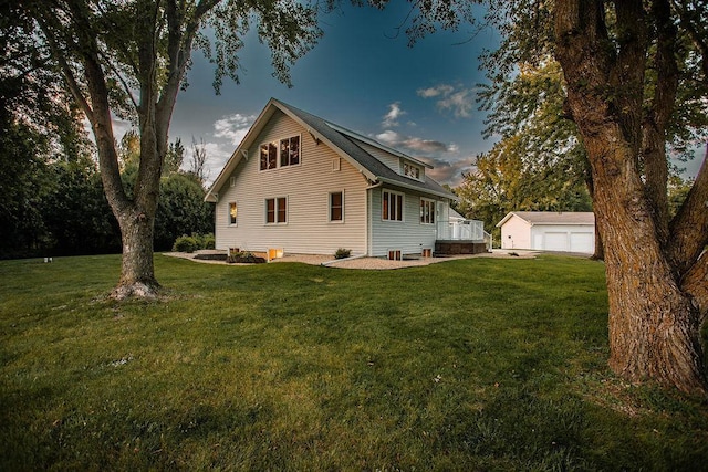 view of home's exterior with an outdoor structure, a lawn, and a garage