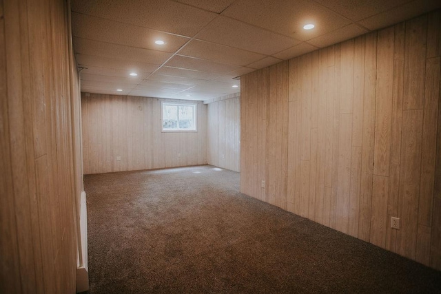 interior space with recessed lighting, wood walls, and a paneled ceiling