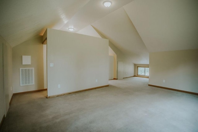 bonus room featuring visible vents, carpet flooring, baseboards, and lofted ceiling