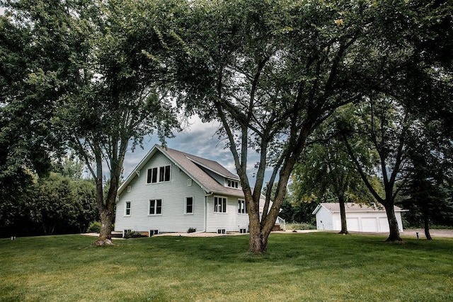 view of side of property featuring a yard