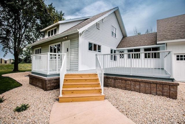 exterior space with a shingled roof