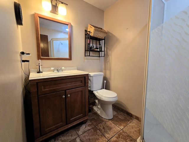 full bath with toilet, a stall shower, and vanity