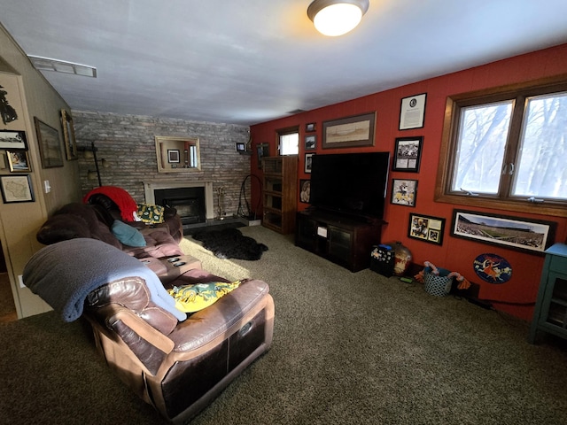 carpeted living room featuring a fireplace