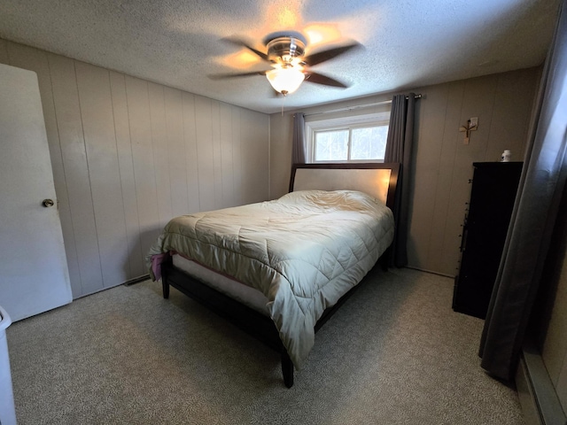 bedroom with light carpet, ceiling fan, and a textured ceiling