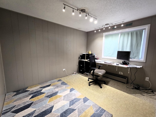 office area with a textured ceiling