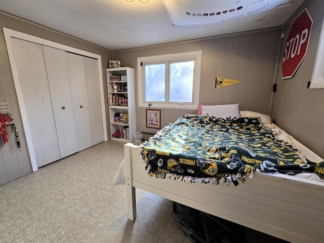 bedroom with a closet and a textured ceiling