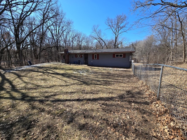 exterior space with a front lawn and fence