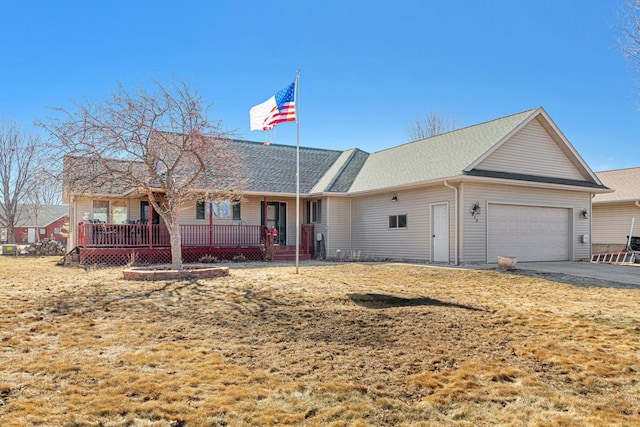 ranch-style home with a garage and driveway