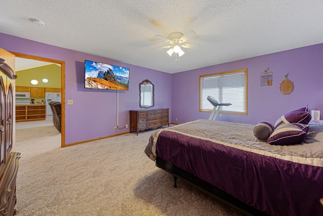 bedroom with a textured ceiling, light carpet, a ceiling fan, baseboards, and white fridge with ice dispenser