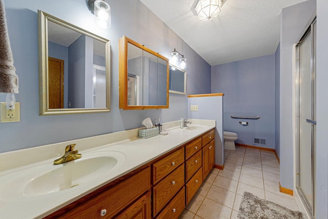 bathroom with tile patterned flooring, visible vents, a sink, and toilet